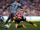 Sunderland's Irish defender John O'Shea vies with Newcastle United's French midfielder Moussa Sissoko during the English Premier League football match between Sunderland and Newcastle United at The Stadium of Light in Sunderland, north east England on Apr
