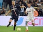 Paris Saint-Germain's Swedish midfielder Zlatan Ibrahimovic (L) vies with Marseille's French defender Jeremy Morel during the French L1 football match between Marseille (OM) and Paris (PSG) on April 5, 2015