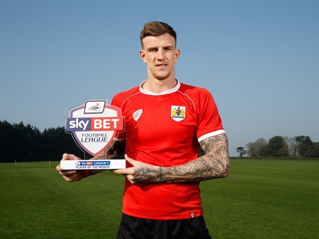 Bristol City's Aden Flint poses with his Player of the Month award for March 2015