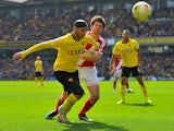 Adlene Guedioura of Watford FC holds off George Friend of Middlesbrough FC during the Sky Bet Championship match between Watford and Middlesbrough at Vicarage Road on April 6, 2015