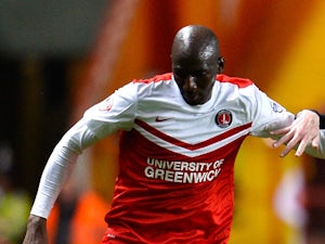 Alou Diarra of Charlton holds off Danny Guthrie of Fulham during the Sky Bet Championship match between Charlton Athletic and Fulham at The Valley on April 7, 2015