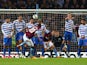 Christian Benteke of Aston Villa (20) scores their third goal from a free kick and completes his hat trick during the Barclays Premier League match between Aston Villa and Queens Park Rangers at Villa Park on April 7, 2015