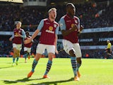 Christian Benteke of Aston Villa celebrates scoring their first goal with Tom Cleverley of Aston Villa during the Barclays Premier League match between Tottenham Hotspur and Aston Villa at White Hart Lane on April 11, 2015