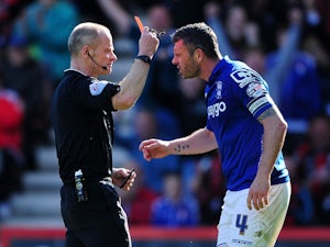 Referee, Andy Woolmer shows a red card to Paul Robinson of Birmingham City during the Sky Bet Championship match between AFC Bournemouth and Birmingham City at Goldsands Stadium on April 6, 2015
