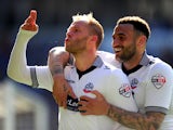 Bolton players Eidur Gudjohnsen and Craig Davies celebrate the first Bolton goal during the Sky Bet Championship match between Cardiff City and Bolton Wanderers at Cardiff City Stadium on April 6, 2015