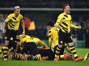 Dortmund's players celebrate during the German Football Cup DFB Pokal quarter-final match between Borussia Dortmund and 1899 Hoffenheim in Dortmund, western Germany, on April 7, 2015