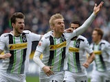 Monchengladbach's Swedish defender Oscar Wendt and his teammates celebrate after a goal during the German first division Bundesliga football match between Borussia Monchengladbach v Borussia Dortmund in Moenchengladbach, Germany, on April 11, 2015