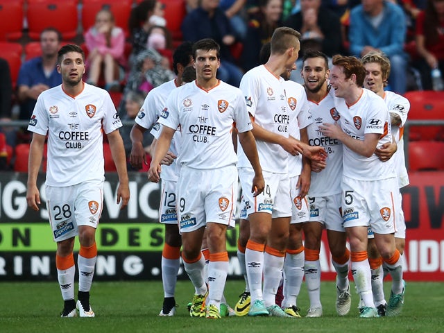 Brisbane players celebrates with teammate Andrija Kaluderovic after he scored a goal during the round 25 A-League match between Adelaide United and the Brisbane Roar at Coopers Stadium on April 11, 2015