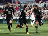 Aaron Lennon of Everton celebrates scoring the opening goal with Seamus Coleman and Ross Barkley of Everton during the Barclays Premier League match between Swansea City and Everton at Liberty Stadium on April 11, 2015