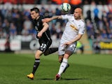 Seamus Coleman of Everton and Jonjo Shelvey of Swansea battle for the ball during the Barclays Premier League match between Swansea City and Everton at Liberty Stadium on April 11, 2015