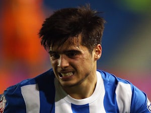 Joao Teixeira of Brighton & Hove Albion reacts to a tackle during the Sky Bet Championship match between Brighton & Hove Albion and Ipswich Town at Amex Stadium on January 21, 2015