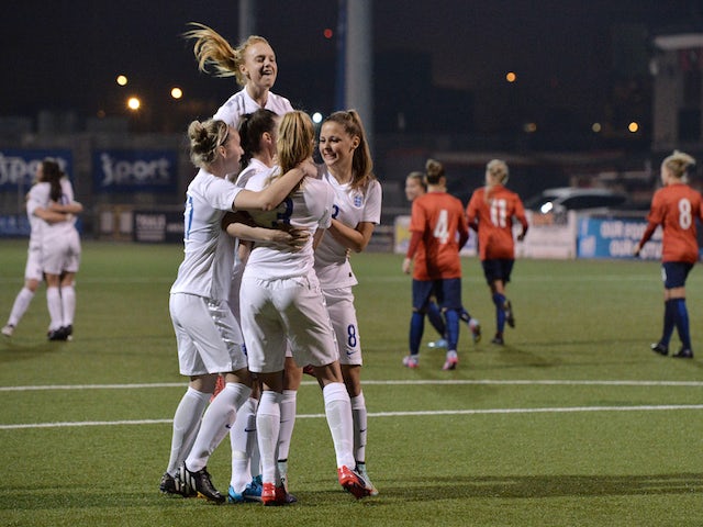 Leah Williamson of England celebrates with team mates after a retaking a last minute penalty during the UEFA U19 Women's Qualifier between England and Norway at Seaview on April 9, 2015 in Belfast, Northern Ireland. The original penalty, taken during the 