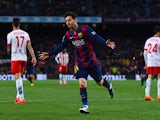 Lionel Messi of FC Barcelona celebrates after scoring the opening goal during the La Liga match between FC Barcelona and UD Almeria at Camp Nou on April 8, 2015