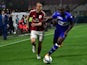 AC Milan's defender Luca Antonelli (L) fights for the ball with Sampdoria's forward Stefano Okaka during the Italian Serie A football match between AC Milan and Sampdoria at San Siro Stadium in Milan on April 12, 2015