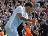 Manchester City's Argentinian striker Carlos Tevez celebrates scoring his third goal with a golf swing celebration during the English Premier League football match between Norwich City and Manchester City at Carrow Road stadium in Norwich, England on Apri