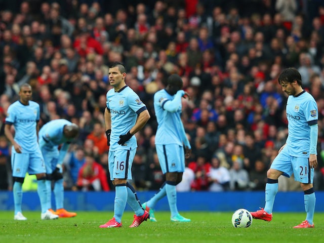 Dejection amongst the Manchester City ranks after a fourth goal by Manchester United on April 12, 2015
