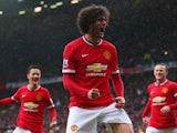 Marouane Fellaini of Manchester United celebrates as he scores their second goal with a header during the Barclays Premier League match between Manchester United and Manchester City at Old Trafford on April 12, 2015