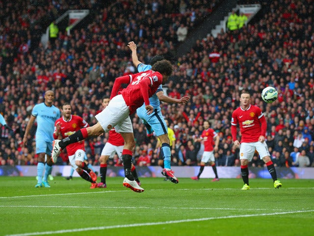 Marouane Fellaini of Manchester United scores their second goal with a header during the Barclays Premier League match between Manchester United and Manchester City at Old Trafford on April 12, 2015