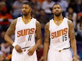 Markieff Morris #11 and Marcus Morris #15 of the Phoenix Suns during the NBA game against the Houston Rockets at US Airways Center on February 10, 2015