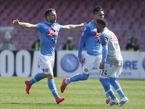 Napoli's forward from Belgium Dries Mertens celebrates with teammates after scoring during the Italian Serie A football match SSC Napoli vs Fiorentina ACF on April 12, 2015