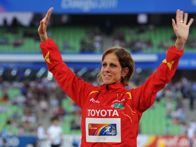 Bronze medallist Natalia Rodriguez of Spain waves to the crowd during the award ceremony for the women's 1500 metres hurdles event at the International Association of Athletics Federations (IAAF) World Championships in Daegu on September 2, 2011