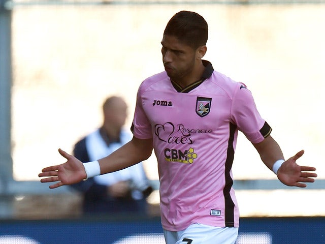 Achraf Lazaar of Palermo celebrates after scoring the opening goal during the Serie A match between Udinese Calcio and US Citta di Palermo at Stadio Friuli on April 12, 2015