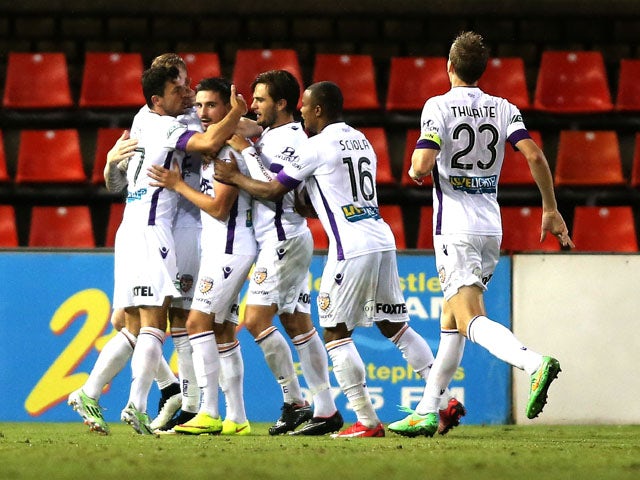Glory players celebrate a goal during the round 24 A-League match between the Newcastle Jets and Perth Glory at Hunter Stadium on April 6, 2015