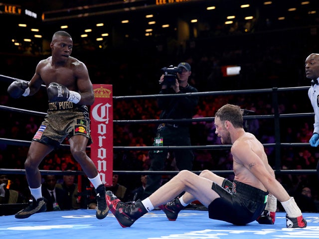 Peter Quillin knocks down Andy Lee during the Premier Boxing Champions Middleweight bout at Barclays Center on April 11, 2015