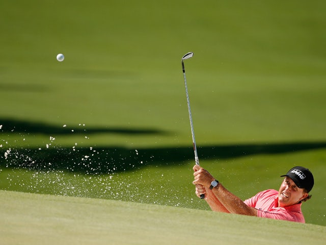 Phil Mickelson of the United States plays a bunker shot on the seventh hole during the third round of the 2015 Masters Tournament at Augusta National Golf Club on April 11, 2015