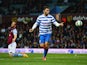Ron Vlaar of Aston Villa look dejected as Charlie Austin of QPR (9) celebrates as he scores their third goal during the Barclays Premier League match between Aston Villa and Queens Park Rangers at Villa Park on April 7, 2015