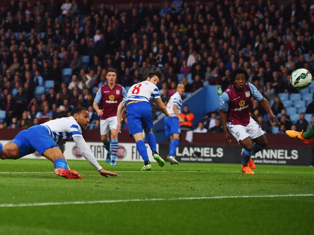 Matt Phillips of QPR scores their first goal with a header during the Barclays Premier League match between Aston Villa and Queens Park Rangers at Villa Park on April 7, 2015