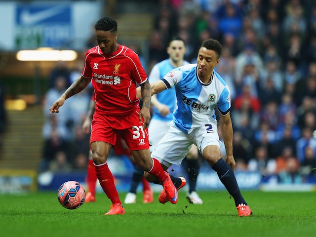 Raheem Sterling of Liverpool holds off Adam Henley of Blackburn Rovers during the FA Cup Quarter Final Replay match between Blackburn Rovers and Liverpool at Ewood Park on April 8, 2015