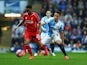 Raheem Sterling of Liverpool holds off Adam Henley of Blackburn Rovers during the FA Cup Quarter Final Replay match between Blackburn Rovers and Liverpool at Ewood Park on April 8, 2015