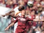 Roma's forward Victor Ibarbo fights for the ball with Torino's midfielder Alessandro Gazzi during the Italian Serie A football match Torino Vs AS Roma on April 12, 2015