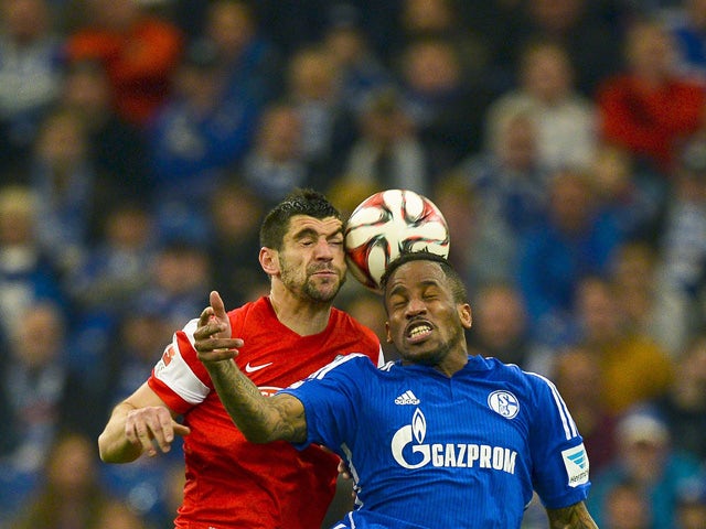 Schalke's Jefferson Farfan vies for the ball with Freiburg's Stefan Mitrovic during the German first division Bundesliga football match between FC Schalke 04 v SC Freiburg in Gelsenkirchen,Germany, on April 11, 2015