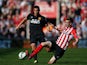 Jake Livermore of Hull City is tackled by Morgan Schneiderlin of Southampton during the Barclays Premier League match between Southampton and Hull City at St Mary's Stadium on April 11, 2015