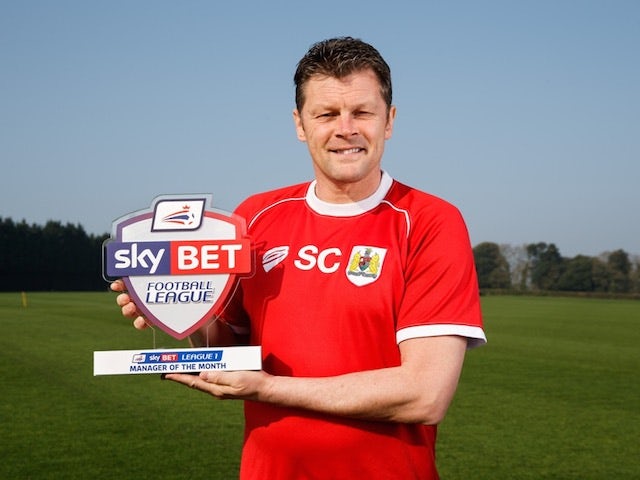 Bristol City boss Steve Cotterill poses with his Manager of the Month award for March 2015