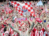 Stoke City fans celebrate their team winning at the final whistle during the FA Cup sponsored by E.ON semi final match between Bolton Wanderers and Stoke City at Wembley Stadium on April 17, 2011