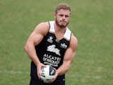 Tom Burgess passes the ball during a South Sydney Rabbitohs NRL training session at Redfern Oval on March 24, 2015 