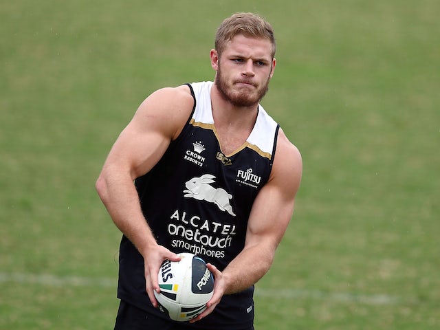 Tom Burgess passes the ball during a South Sydney Rabbitohs NRL training session at Redfern Oval on March 24, 2015 
