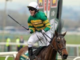 Jockey A P McCoy celebrates after winning on Don't Push It following The Grand National steeplechase at Aintree Racecourse in Liverpool, north-west England on April 10, 2010