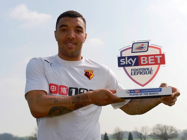 Watford's Troy Deeney poses with his Player of the Month award for March 2015