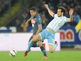 Napoli's player Walter Gargano vies with SS Lazio player Marco Parolo during the Tim cup match between SSC Napoli and SS Lazio at the San Paolo Stadium on April 8, 2015