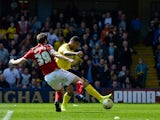 Troy Deeney Watford FC scores the first goal during the Sky Bet Championship match between Watford and Middlesbrough at Vicarage Road on April 6, 2015
