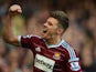 Aaron Cresswell of West Ham celebrates scoring the first goal during the Barclays Premier League match between West Ham United and Stoke City at Boleyn Ground on April 11, 2015