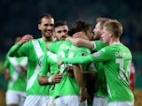 Wolfsburg's Swiss defender Ricardo Rodriguez celebrates after scoring  during the German Football Cup DFB Pokal quarter-final football match between VfL Wolfsburg and SC Freiburg in Wofsburg, central Germany, on April 7, 2015