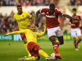Adlène Guédioura of Watford tackles Michail Antonio of Nottingham Forest during the Sky Bet Championship match between Nottingham Forest and Watford at City Ground on April 15, 2015