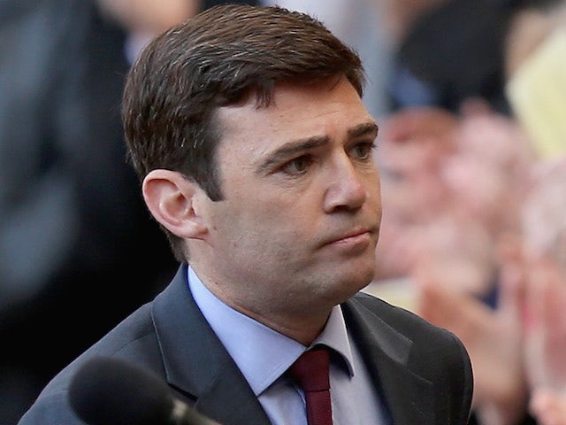 Shadow health secretary Andy Burnham MP is applauded after making a speech during the memorial service marking the 25th anniversary of the Hillsborough Disaster at Anfield stadium on April 15, 2014