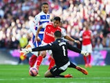 Alexis Sanchez of Arsenal shoots past Adam Federici of Reading during the FA Cup Semi Final between Arsenal and Reading at Wembley Stadium on April 18, 2015