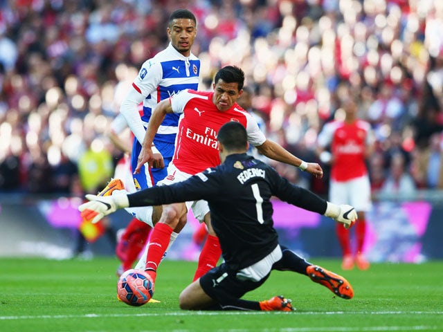 Alexis Sanchez of Arsenal shoots past Adam Federici of Reading during the FA Cup Semi Final between Arsenal and Reading at Wembley Stadium on April 18, 2015